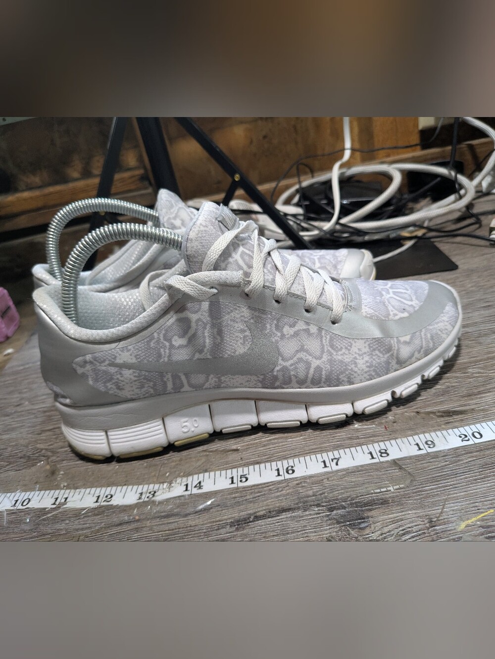 Nike Free 5.0 running shoes with a gray and white snake print Women Size 10